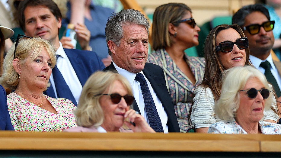 Hugh Grant’s Wimbledon Nap Behind Queen Camilla Steals the Show at 2025 Championships