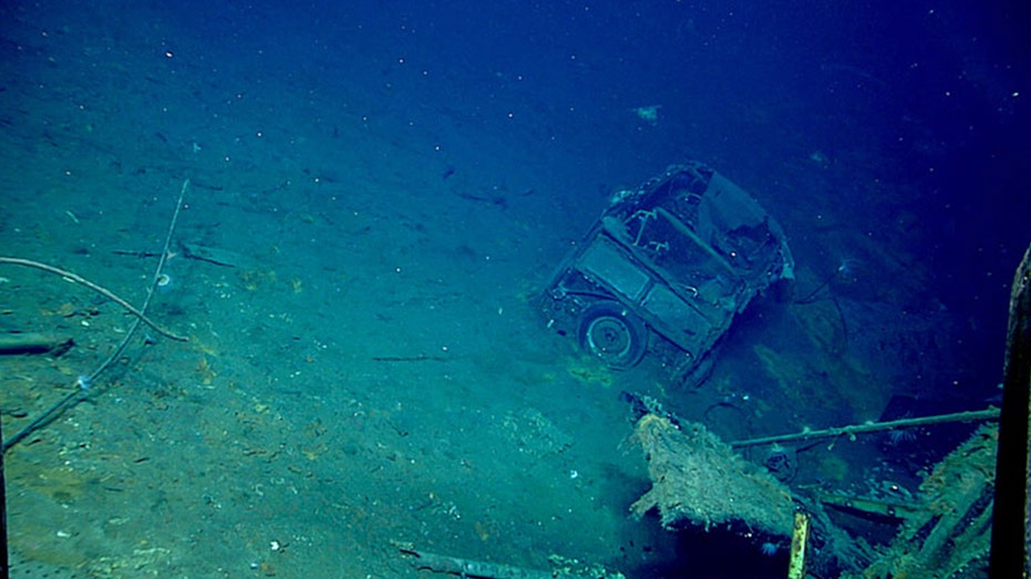 Divers Uncover Vintage Ford Woody in Sunken WWII Aircraft Carrier
