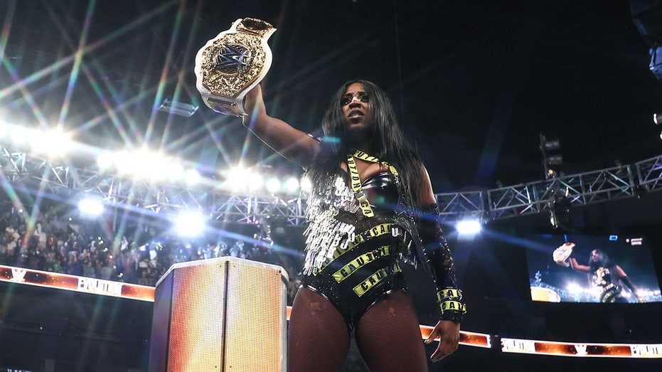 Naomi Shocks WWE Evolution, Claims Women’s World Champion Title with Money in the Bank Cash-In