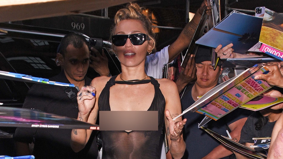 Miley Cyrus Shocks Fans in Sheer Dress at New York Album Signing
